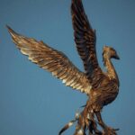 Elegant bronze bird sculpture with outstretched wings in Fethiye, Türkiye.